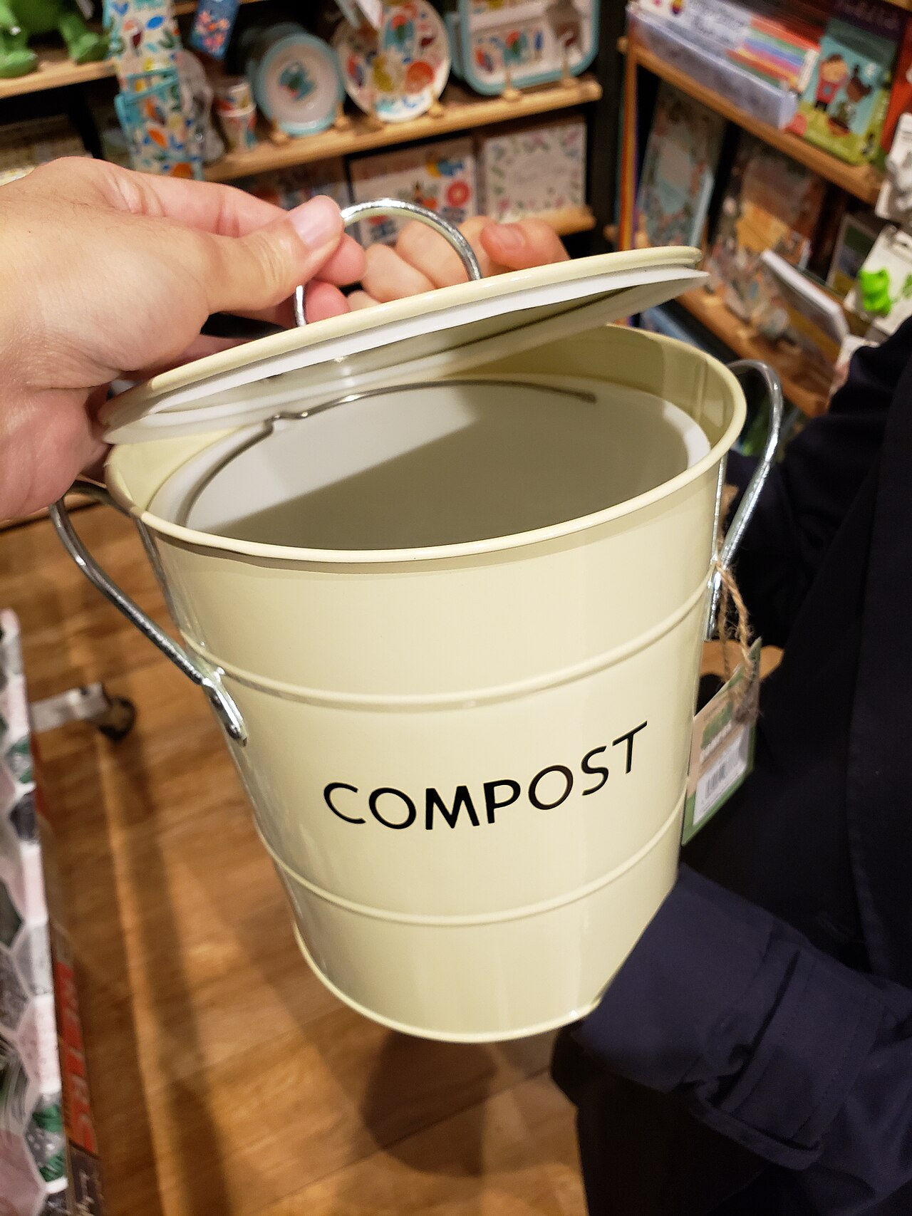 Small countertop compost collection bin on a kitchen counter