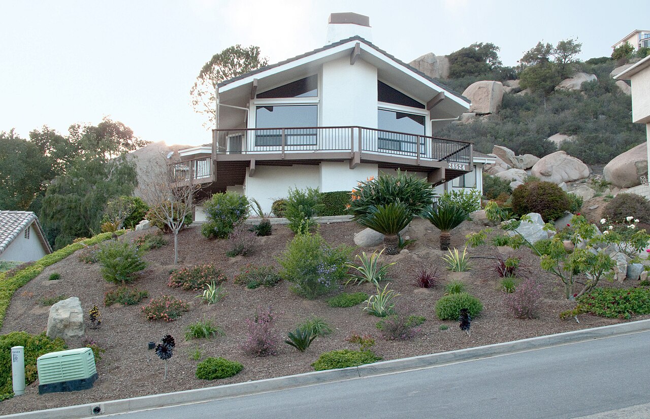 Xeriscaped front yard with gravel mulch and drought-tolerant perennials